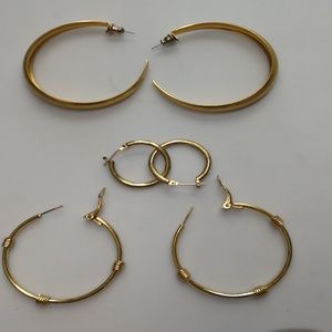 3 pairs of golden tone earrings
